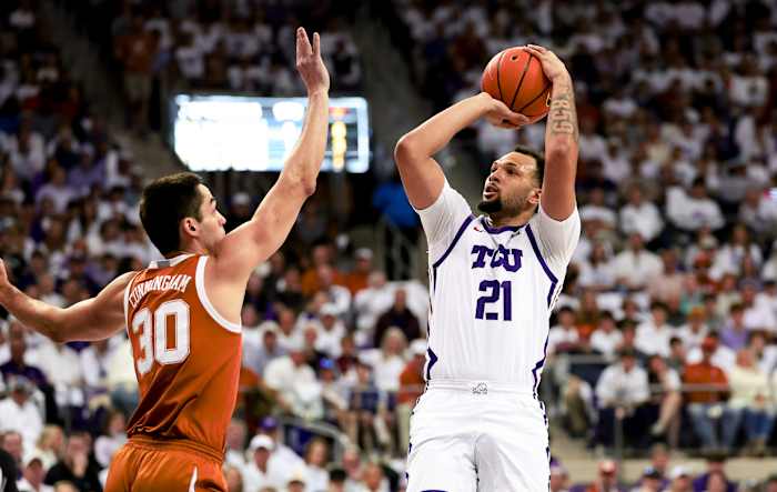 Feb 3, 2024; Fort Worth, Texas, USA; TCU Horned Frogs forward JaKobe Coles (21) shoots over Texas Longhorns forward Brock Cunningham (30) during the first half at Ed and Rae Schollmaier Arena. Mandatory Credit: Kevin Jairaj-USA TODAY Sports